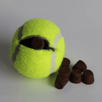 tennis ball cut open and dog treats